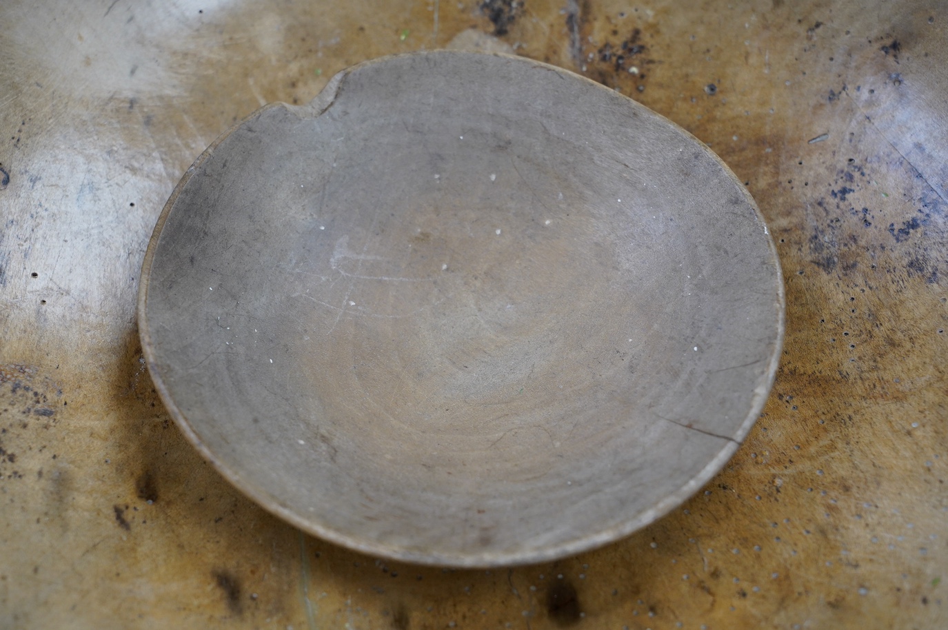 An 18th/19th century sycamore mixing bowl and a smaller bowl, largest 44cm diameter. Condition - poor